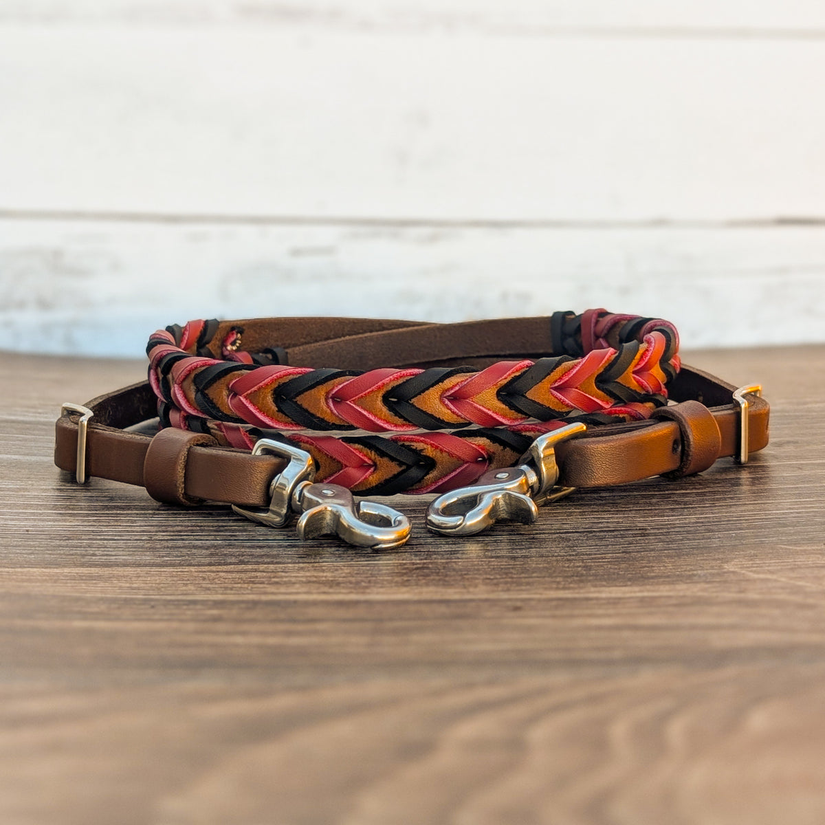 Black and red double laced barrel reins