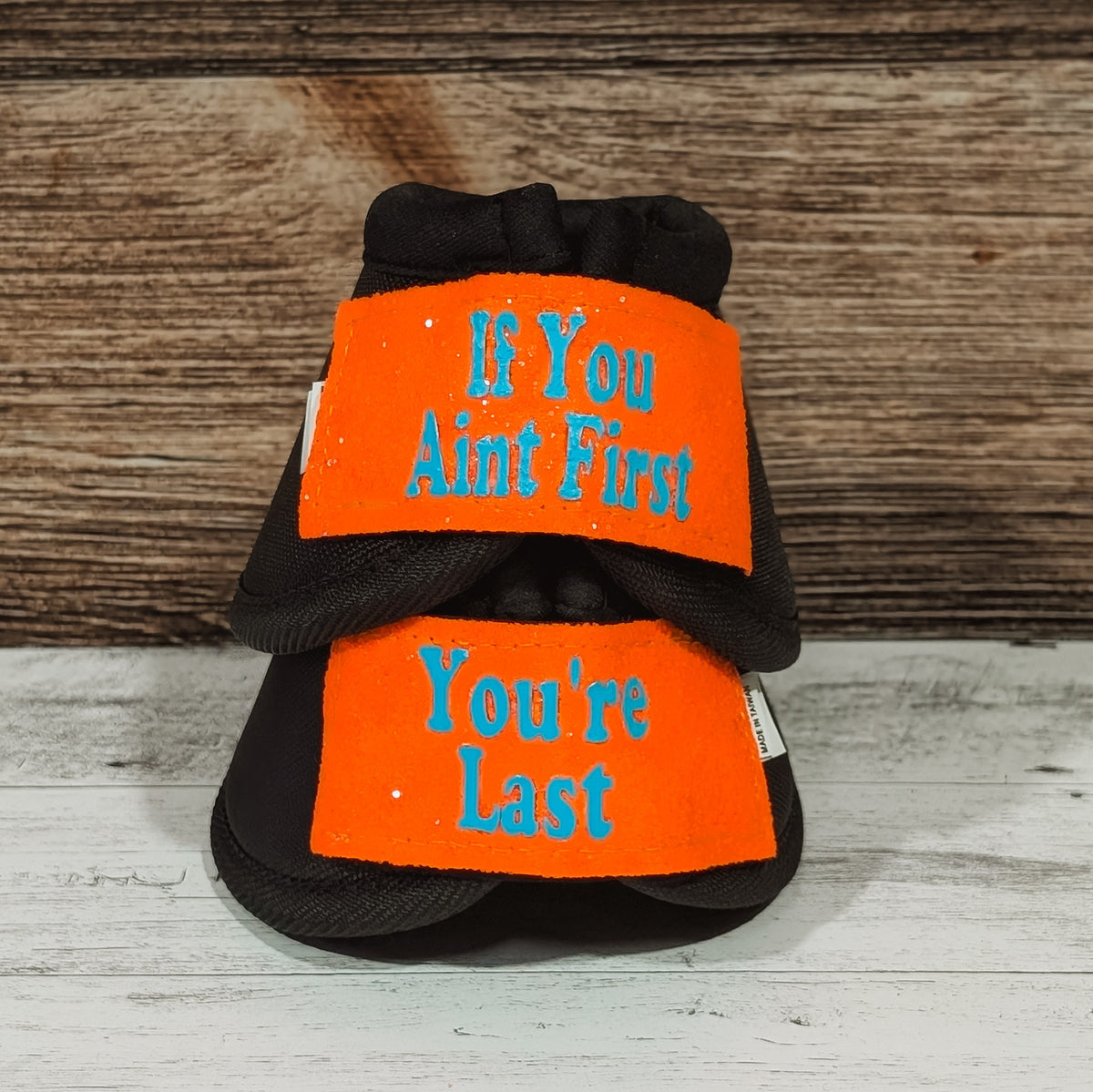 Large Black "If You Ain't First" Bells w/ Neon Orange Glitter Straps