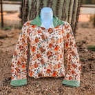 Pumpkin Spice button down with green cuffs and collar