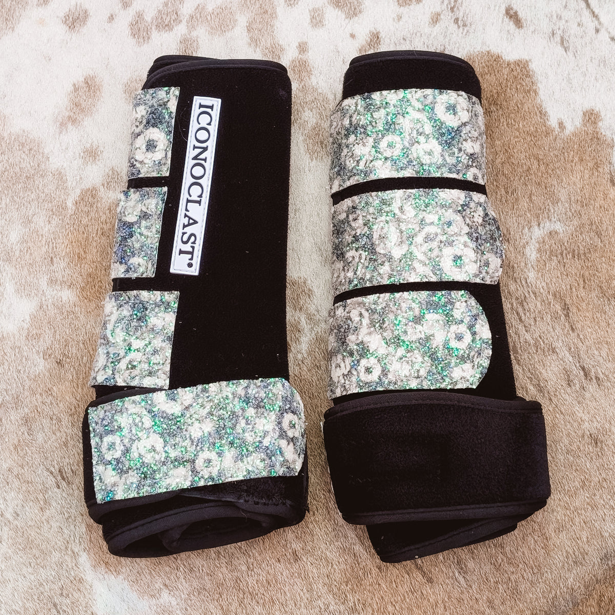 Large black Iconoclast front boots with grey and green rose pattern glitter straps