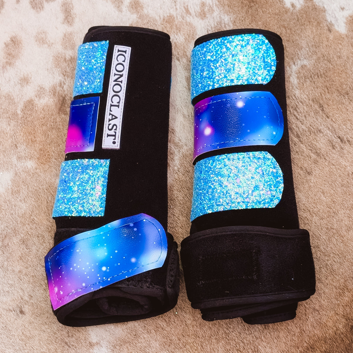 Medium black Iconoclast front boots with galaxy print straps and aqua glitter straps