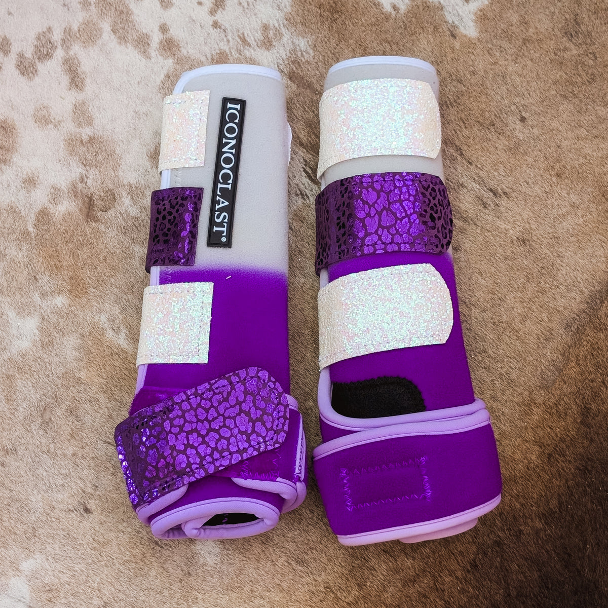 Medium purple dyed Iconoclast hind boots fading from white to purple with purple holographic cheetah and white glitter straps