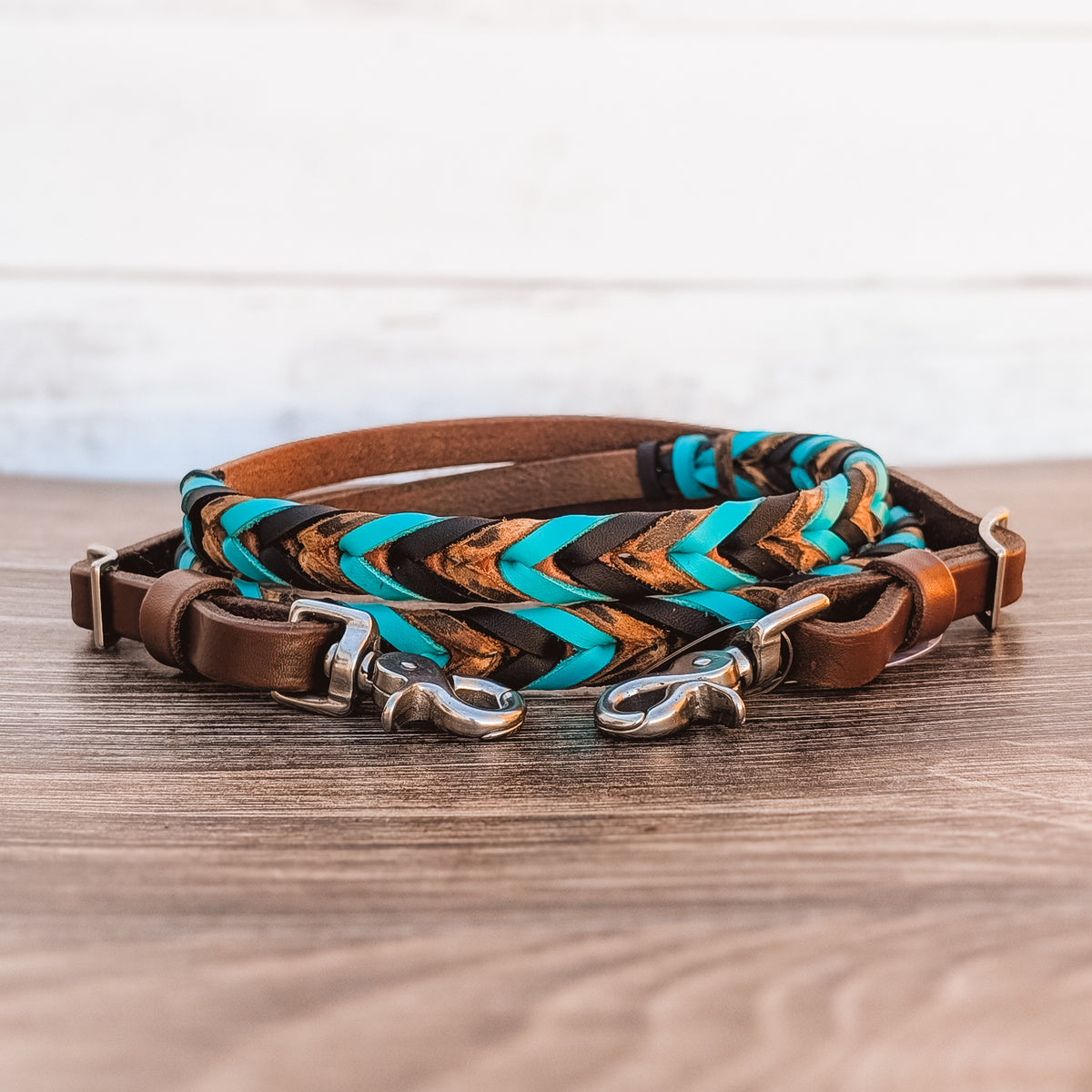 Turquoise, black and cheetah triple laced barrel reins